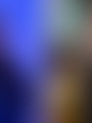 Two images: Left, person in blue lighting, arms crossed, wearing a Nike hoodie. Right, person with sunglasses at a foosball table, saluting.