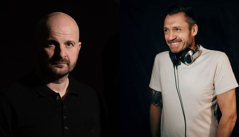 Two men against a dark background. Left man is serious, wearing a black shirt. Right man smiles, wearing headphones and a white shirt.