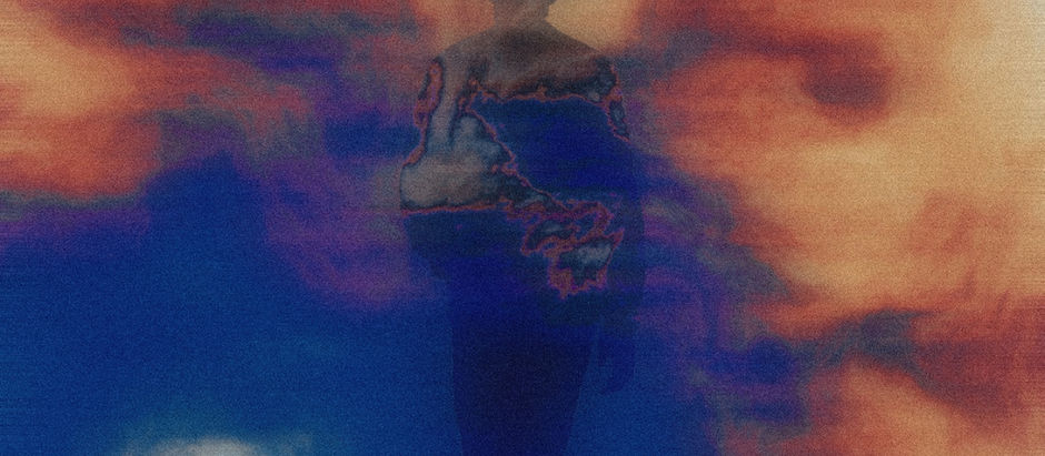Silhouette of a person amidst swirling orange and blue abstract patterns, creating a mysterious and ethereal atmosphere.