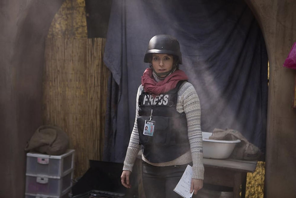 A woman in a helmet and bulletproof vest labeled "press" stands in a house.