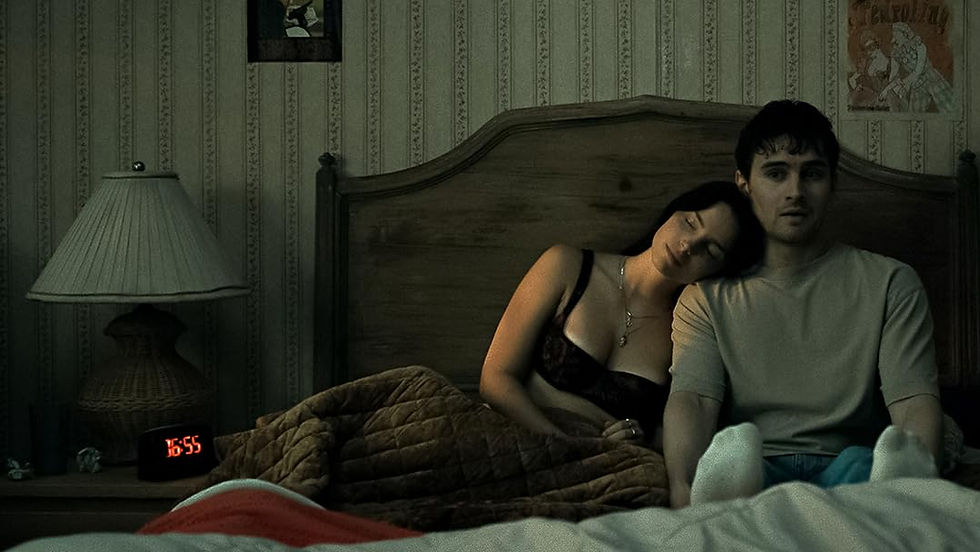 Nikki leans on Bear's shoulder while they sit upright in bed.