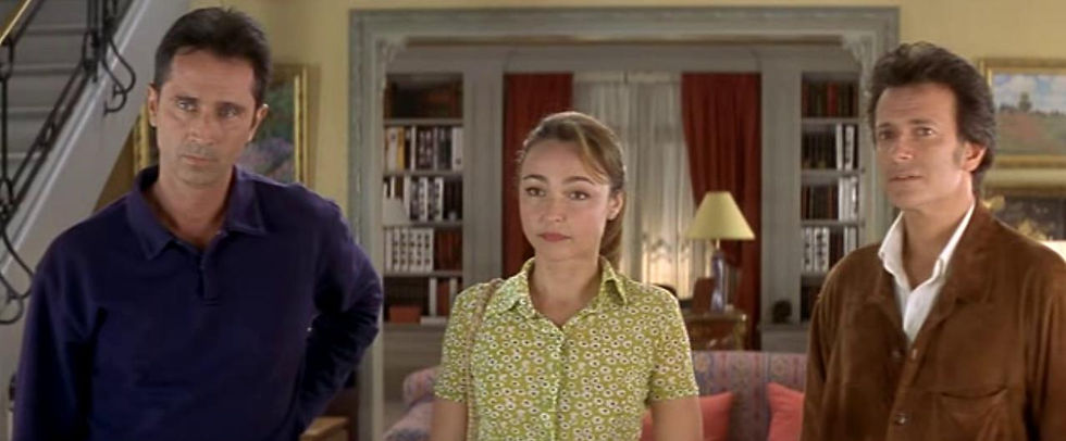 Pierre, Marlène and Juste look at an off-screen third party.