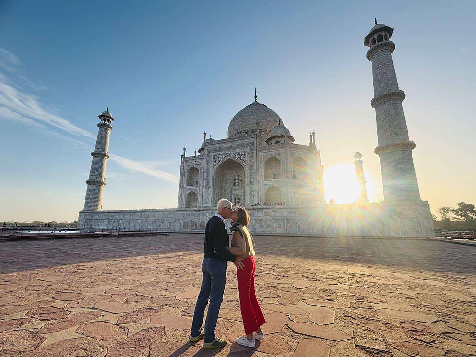 Couple in Sunrise View of Taj Mahal