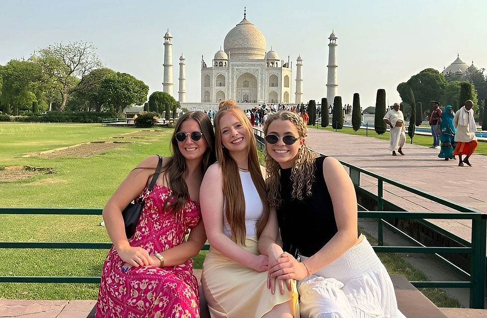 3 female travelers at Taj Mahal during 5 days Golden Triangle tour