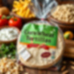 A package of Corn Wheat tortillas sits on a table with other food.