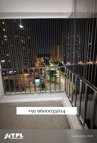 Invisible grill on a balcony, offering safety with an open view.