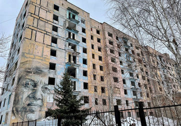 The mural is of a local school teacher, Marina Marchenko - It was painted in 2016 by artists Guido van Helten who wore a bulletproof vest and a helmet, and surrounded by armed forces to cover his back, during active fighting.