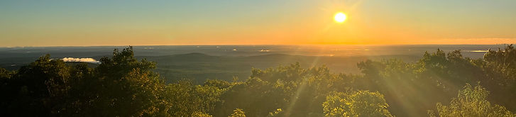 sunset overlooking all the real estate in worcester county from mout wachusett in princeton, ma