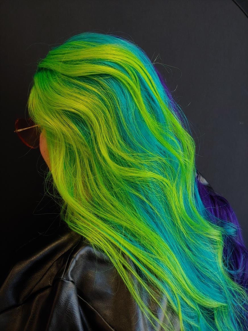 An image of lime green hair with teal tones.