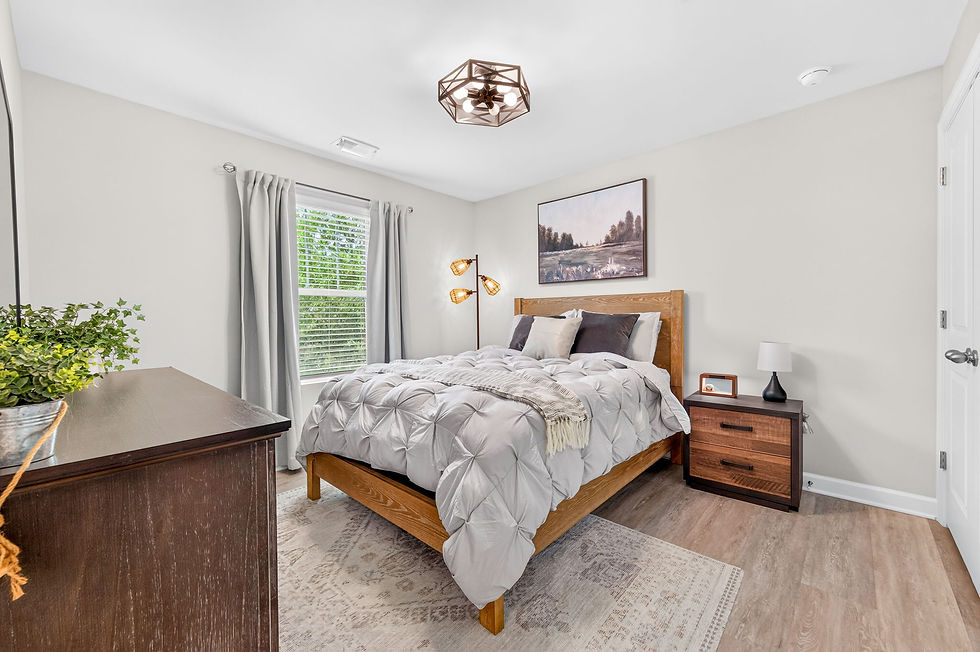 Cozy Bed Centered In Beautifully Lit Bedroom.jpg