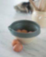 Still life product photography — teal ceramic bowl eggs marble kitchen