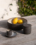 Still life photography Barcelona — dark ceramics lemons outdoor natural light