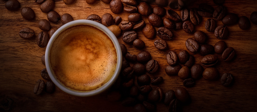 coffee cup with coffee beans arond