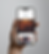 Hand holding an iPhone displaying Taste Like Chicken website