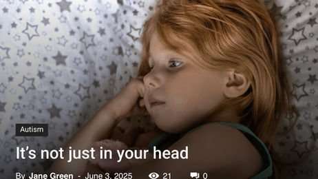 A child lying down looking sad