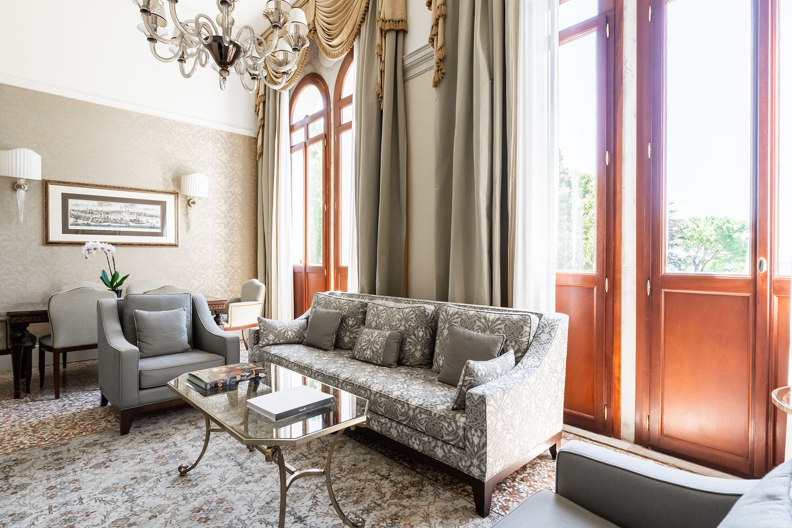 TIEPOLO (2 Bedroom)
Named after the 18th-century painter Tiepolo, this suite features three-metre-high windows and a stunning view over the lagoon.
Classic embellishments – including sumptuous drapes, silk-covered walls, terrazzo flooring and Murano glass chandeliers – define this enchanting private retreat.
Both the salon and bedroom feature lofty ceilings and three-metre-high French doors, opening onto captivating gardens and offering breathtaking views of the setting sun.
Sofa bed is available in the room to ensure a comfortable stay for an additional guest.
130SQM / 1399SQF | Garden and Lagoon View