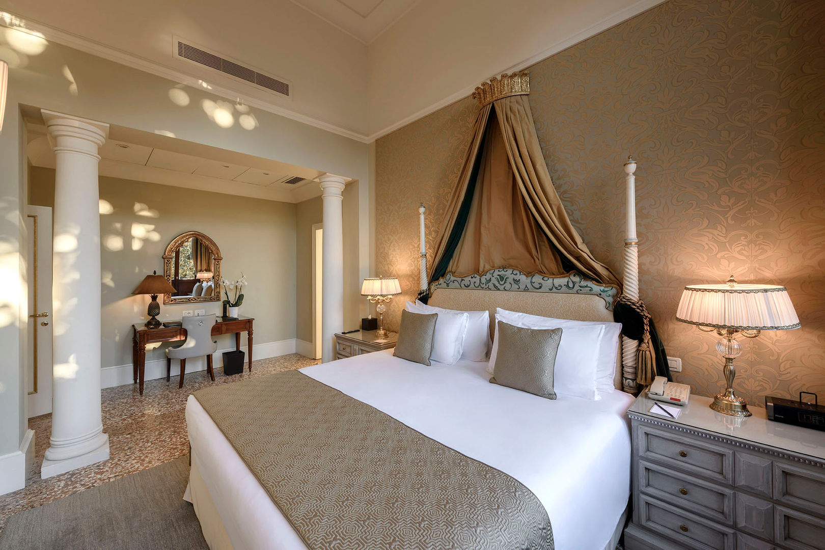 TIEPOLO (2 Bedroom)
Named after the 18th-century painter Tiepolo, this suite features three-metre-high windows and a stunning view over the lagoon.
Classic embellishments – including sumptuous drapes, silk-covered walls, terrazzo flooring and Murano glass chandeliers – define this enchanting private retreat.
Both the salon and bedroom feature lofty ceilings and three-metre-high French doors, opening onto captivating gardens and offering breathtaking views of the setting sun.
Sofa bed is available in the room to ensure a comfortable stay for an additional guest.
130SQM / 1399SQF | Garden and Lagoon View