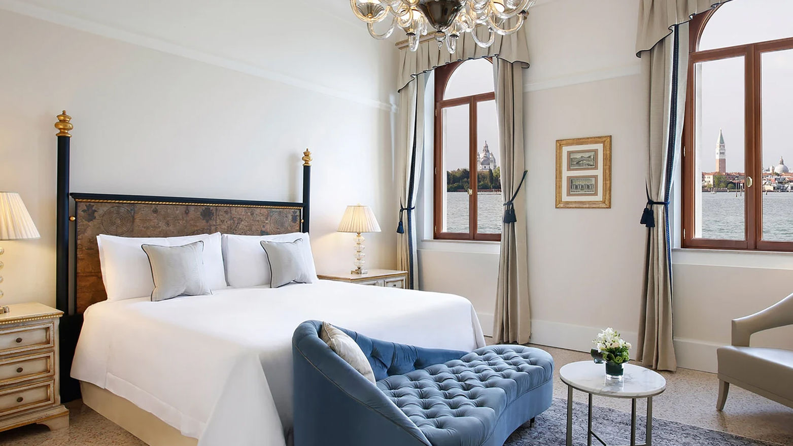 MARCO POLO SUITE
The Marco Polo Suite features a living area with four large windows that frame an enchanting view of St. Mark's Bell Tower, along with an elegant bedroom overlooking the lagoon. An Italian marble bathroom featuring a walk-in shower and separate bath offer guests the highest level of comfort.
Sofa bed is available in the room to ensure a comfortable stay for an additional guest.
110SQM / 1184SQF  |  Lagoon and St. Marco Square View