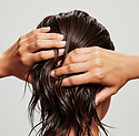 woman-with-wet-hair-hands-head.jpg