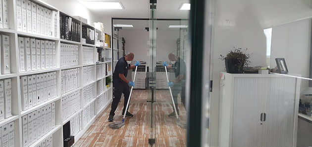 A professional cleaner, spring cleaning an office