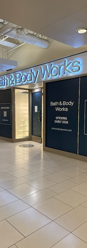 Exterior retail signage and storefront installation prior to store opening.
