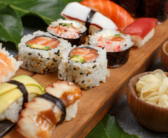 sushi-set-nigiri-and-sushi-rolls-on-a-wo