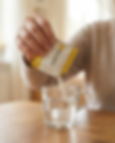PD Balance - woman pouring PD Balance pouch 1 into cup closeup.png