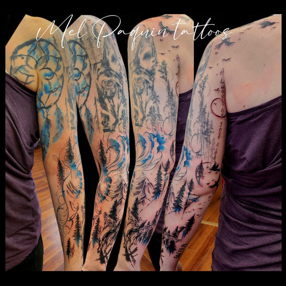 Watercolor tattoo sleeve featuring forests, wolves, mountains, and dreamcatchers. Gatineau tattoo.