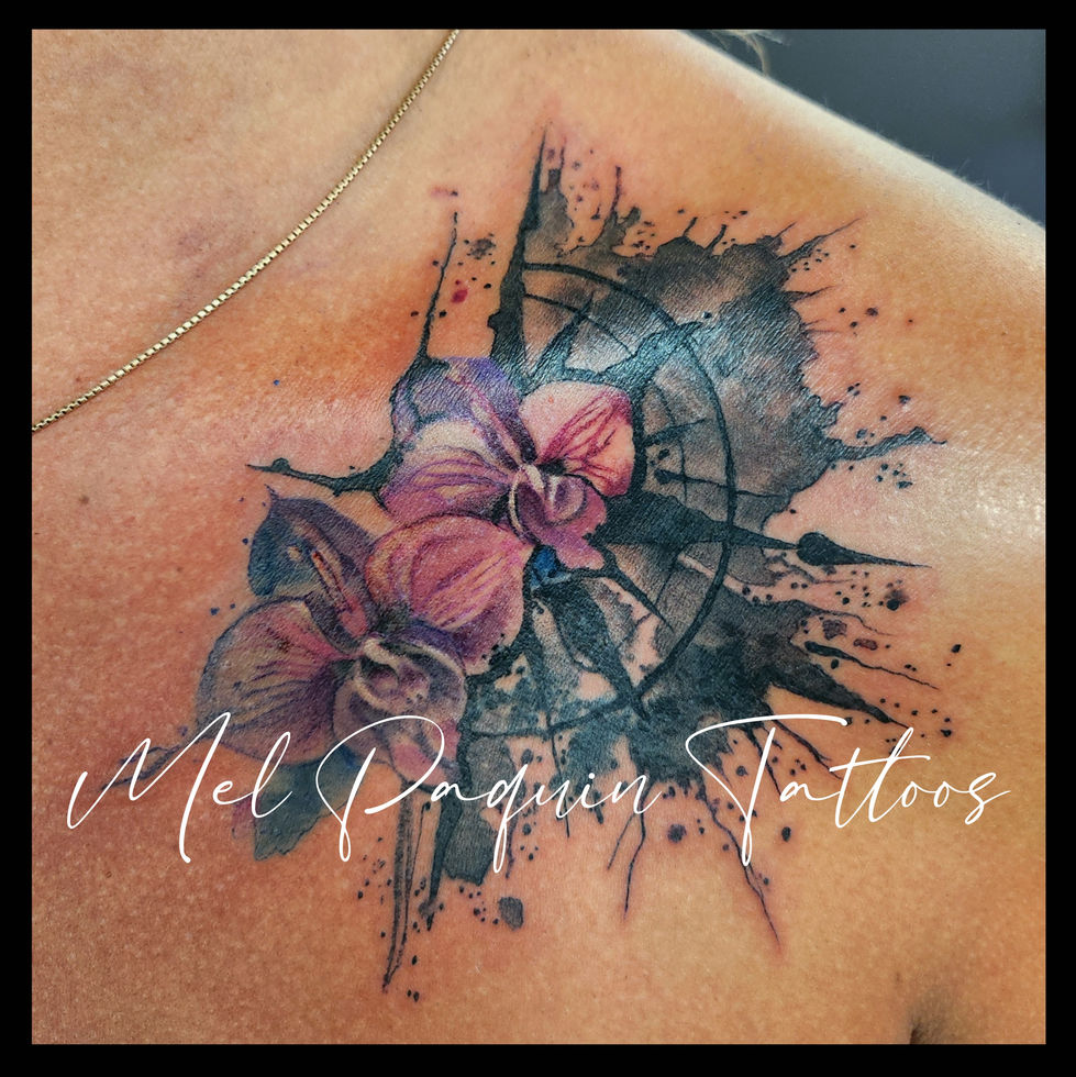 Watercolor tattoo
orchids with
splatters and
compass. Gatineau tattoo