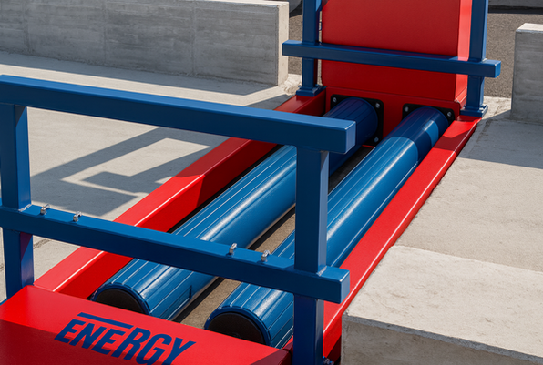 Rodillos industriales en entorno concreto.png