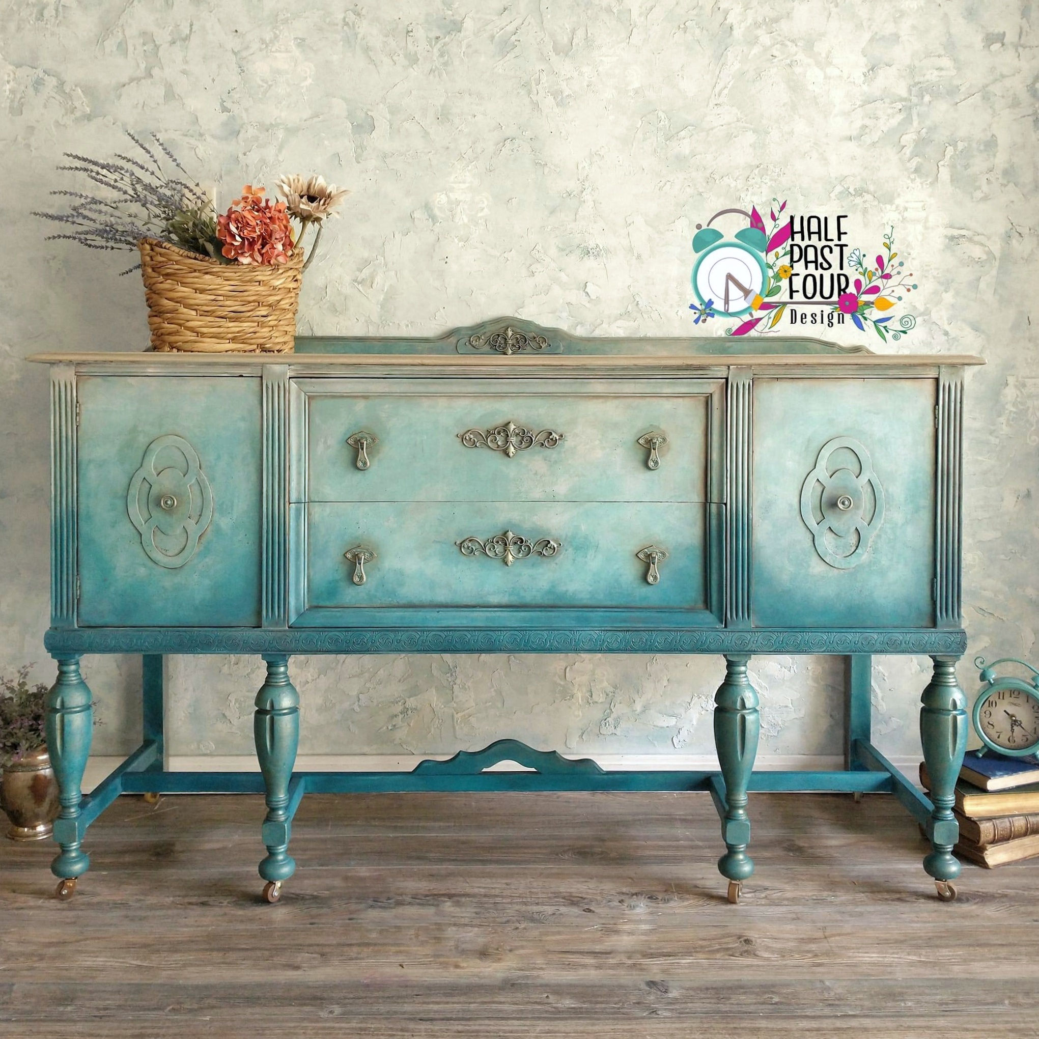 front view of antique buffet painted in blended creams, grays, blues.