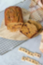 protein pumpkin loaf sliced on a cutting board