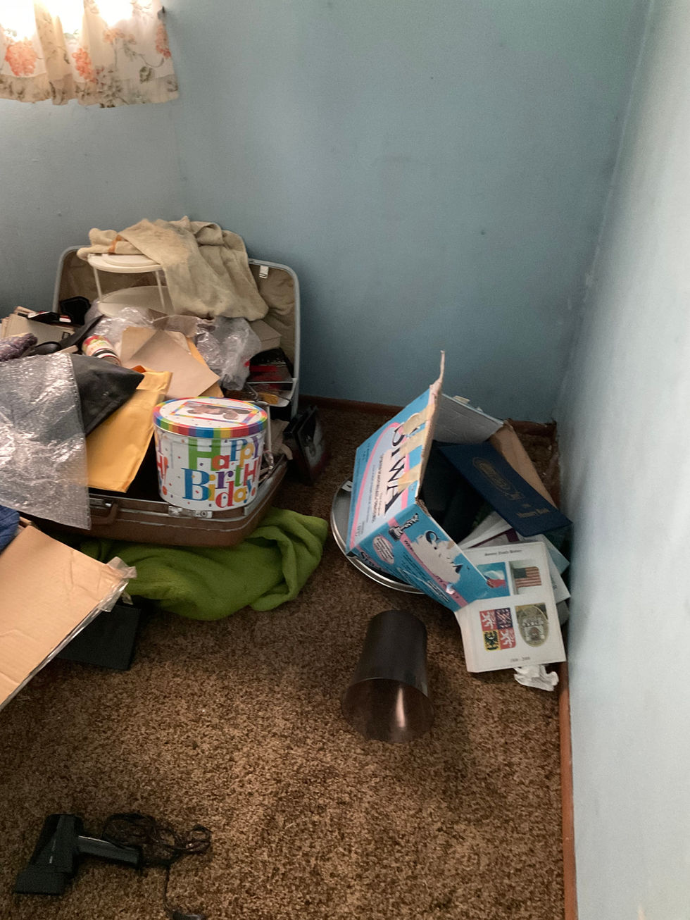 Cluttered bedroom before property cleanout and junk removal in Fullerton ND