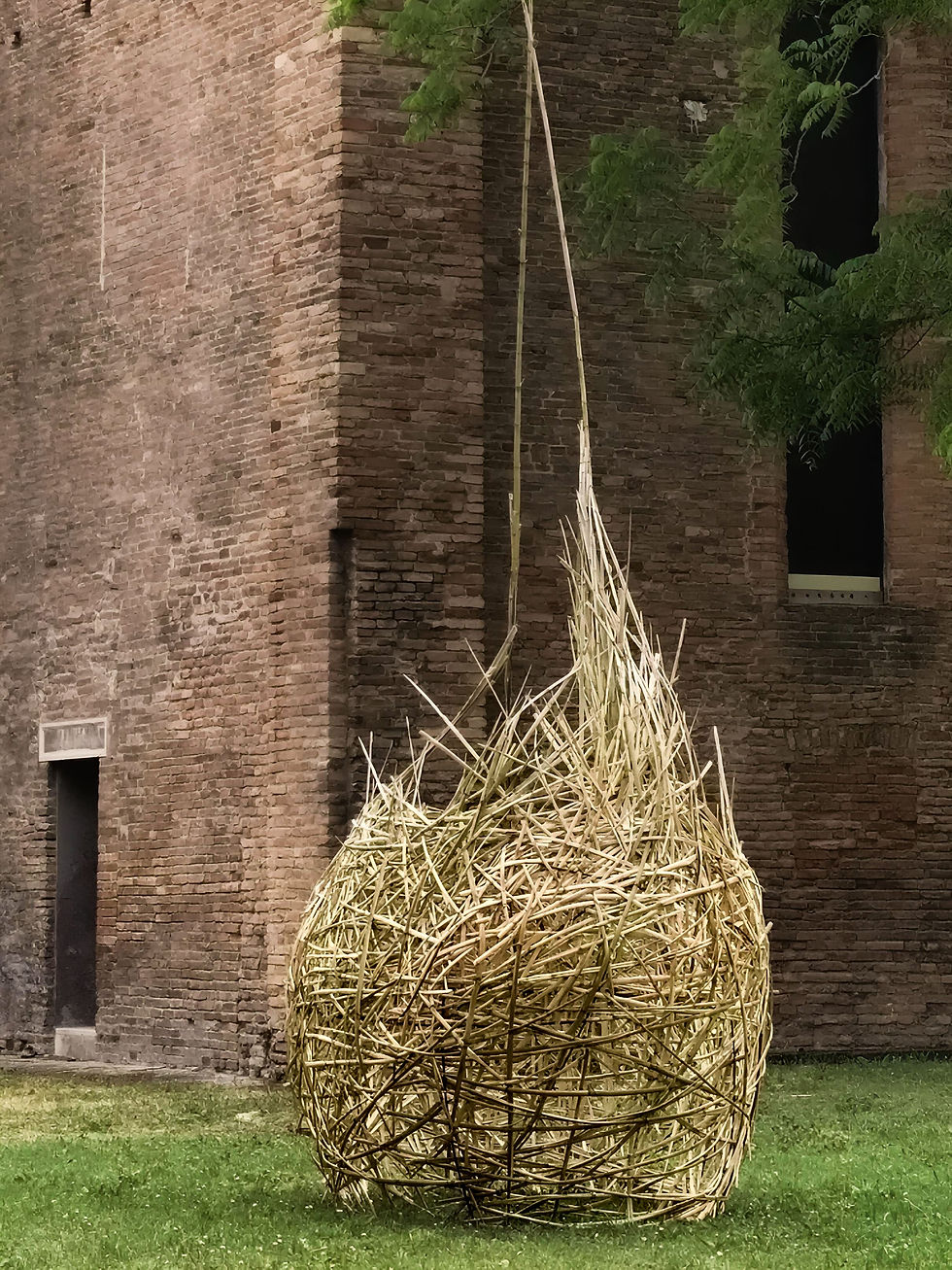 Installation by Oscar Dominguez featured in a critical essay by Roberta Bertozzi, with a suspended white branching structure unfolding inside a historic architectural space.