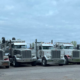 These are four of our Peterbilt trucks and one Kenworth W900.
