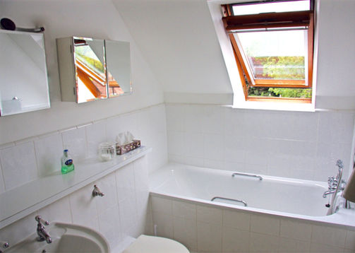 Private bathroom with bath and shower