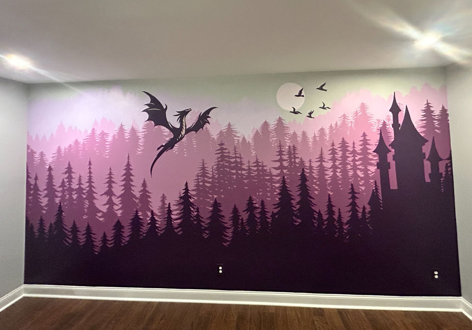 Fantasy-inspired wall mural of a dragon, florals, and a woman rising from stacked books painted above a bookshelf