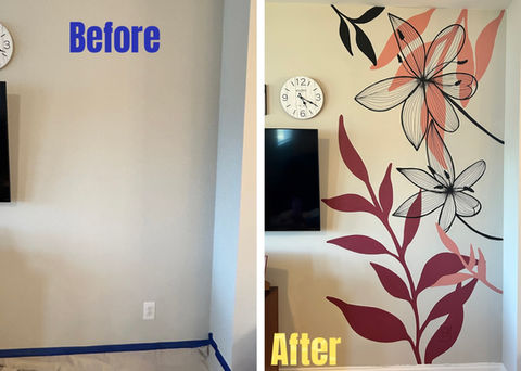 Before and after image. Left: empty wall; right: fully completed mural: Contemporary flower mural with large overlapping leaves and delicate black line-art blooms in red, coral, and blush tones. The artwork wraps around a corner near a mounted TV and wall clock, bringing vibrant organic style to the living space.