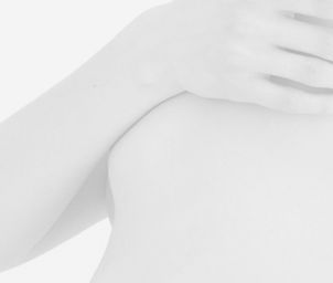 an image of a woman's breast covered with her hand
