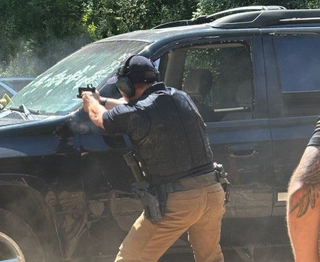 High angle view of a security team conducting a tactical training exercise outdoors