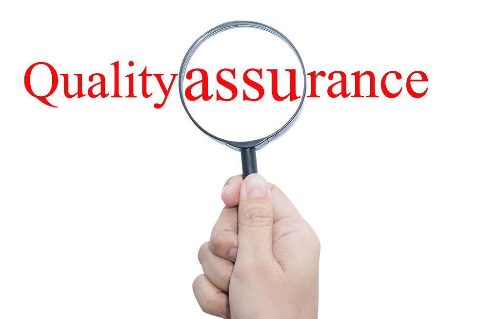 Hand Showing quality assurance Word Through Magnifying Glass .jpg