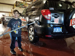 Wyatt keeping Daddys Car Clean!