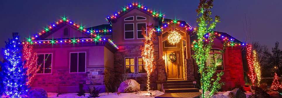 LED Christmas light installation with C9 roofline and tree lights by Southeast Lights in Hattiesburg MS