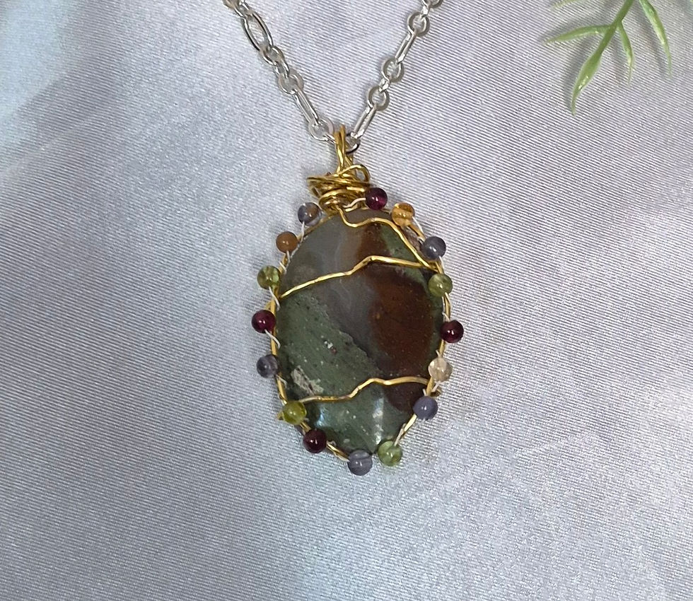 Green and Red Jasper cabochon design is surrounded by color quartz beads with 3 gold wire waves.