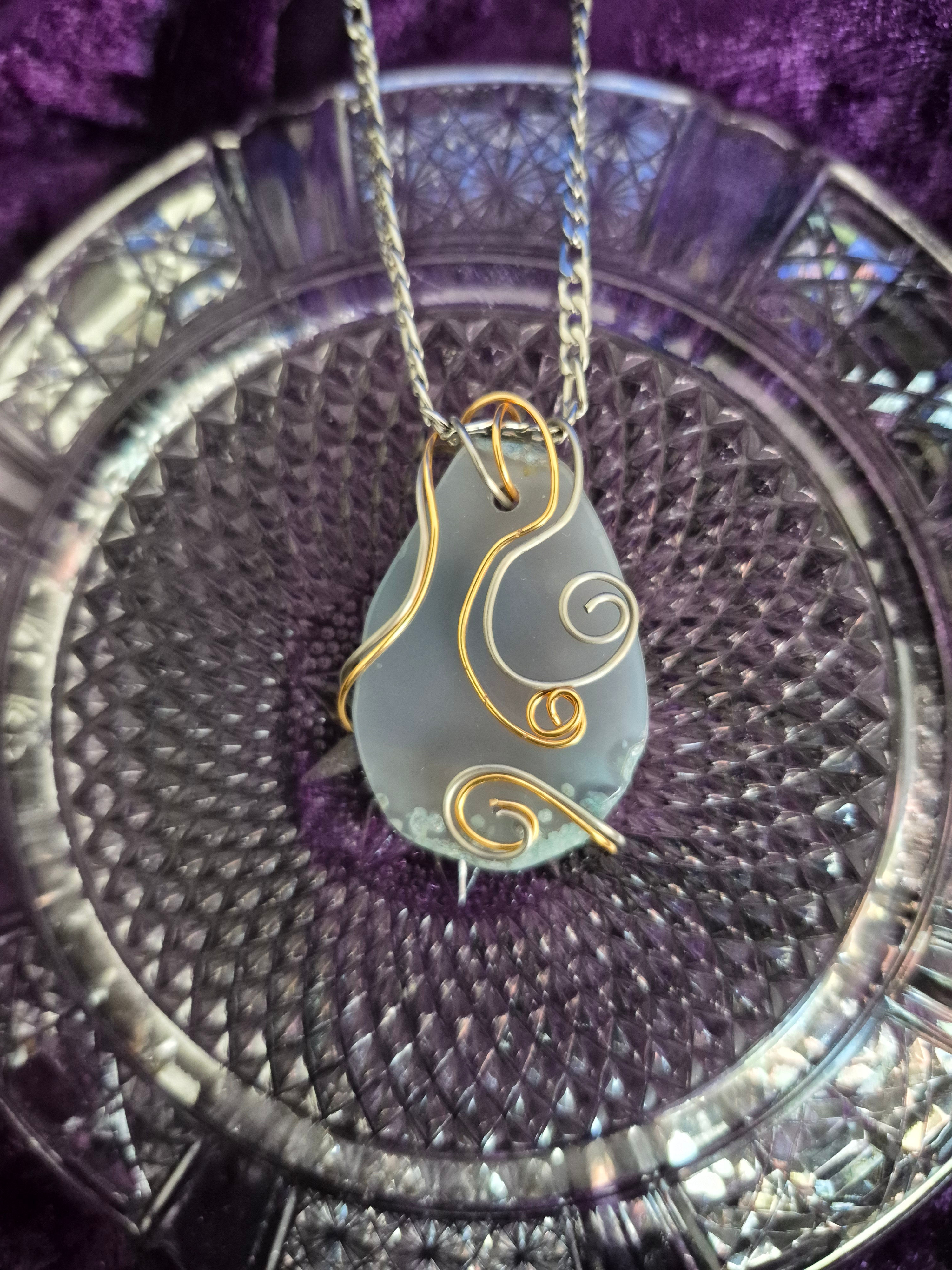 Light Blue agate stone wire is swirled, wrapped with gold and silver wire