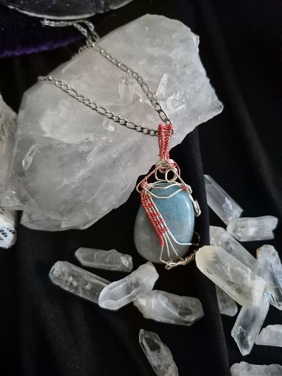 Trolleite stone with pink wire wrap resembling staff paper or harp