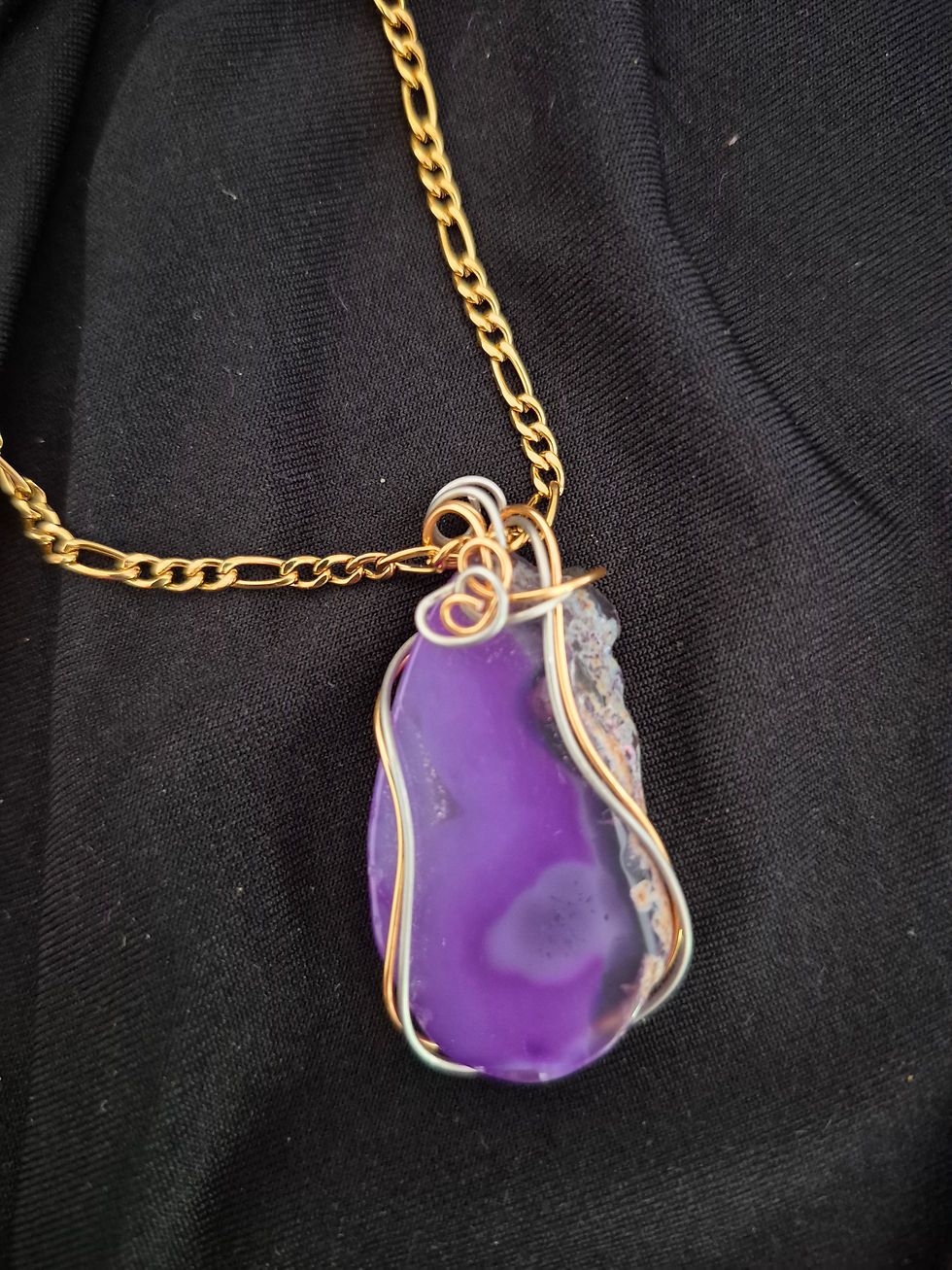 Thumbnail: Royal purple colored agate stone wrapped simply in silver and gold wire with an 18k gold-plated stainless-steel chain