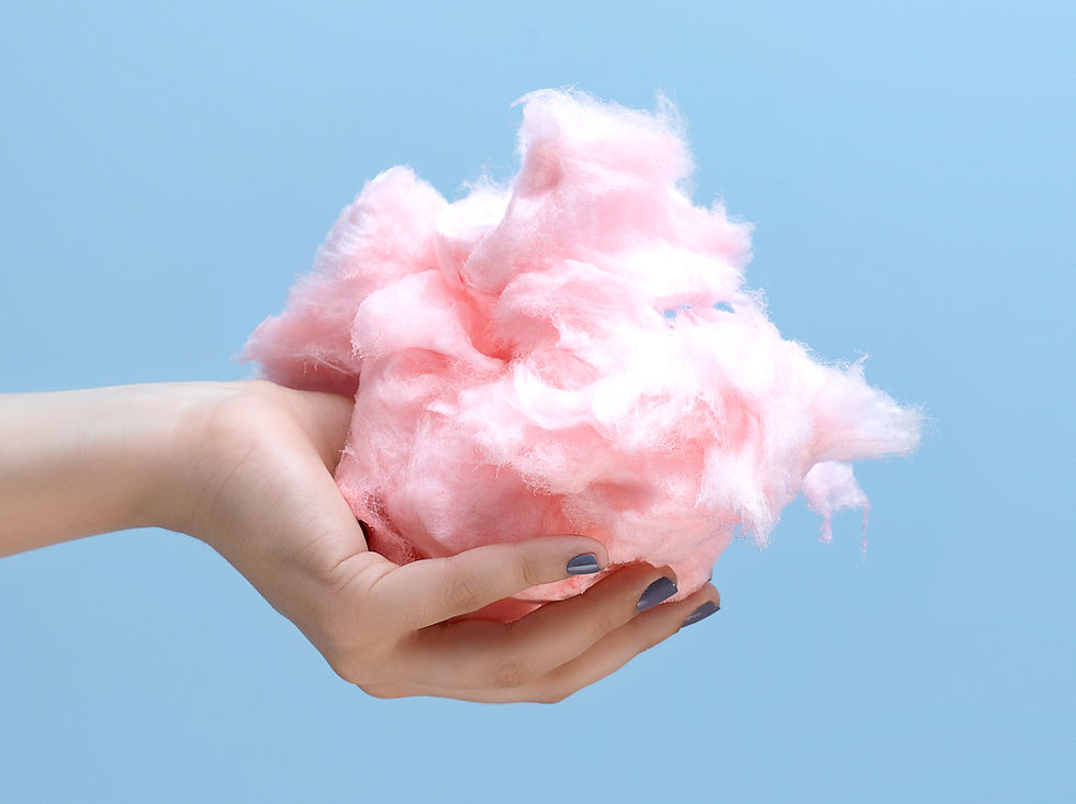 an image of beautiful hand holding a cotton candy