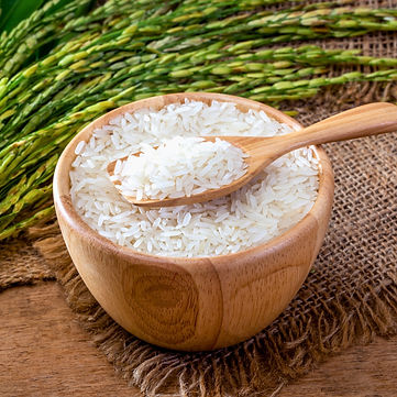A-wooden-bowl-filled-with-raw-Jasmine-rice.jpg