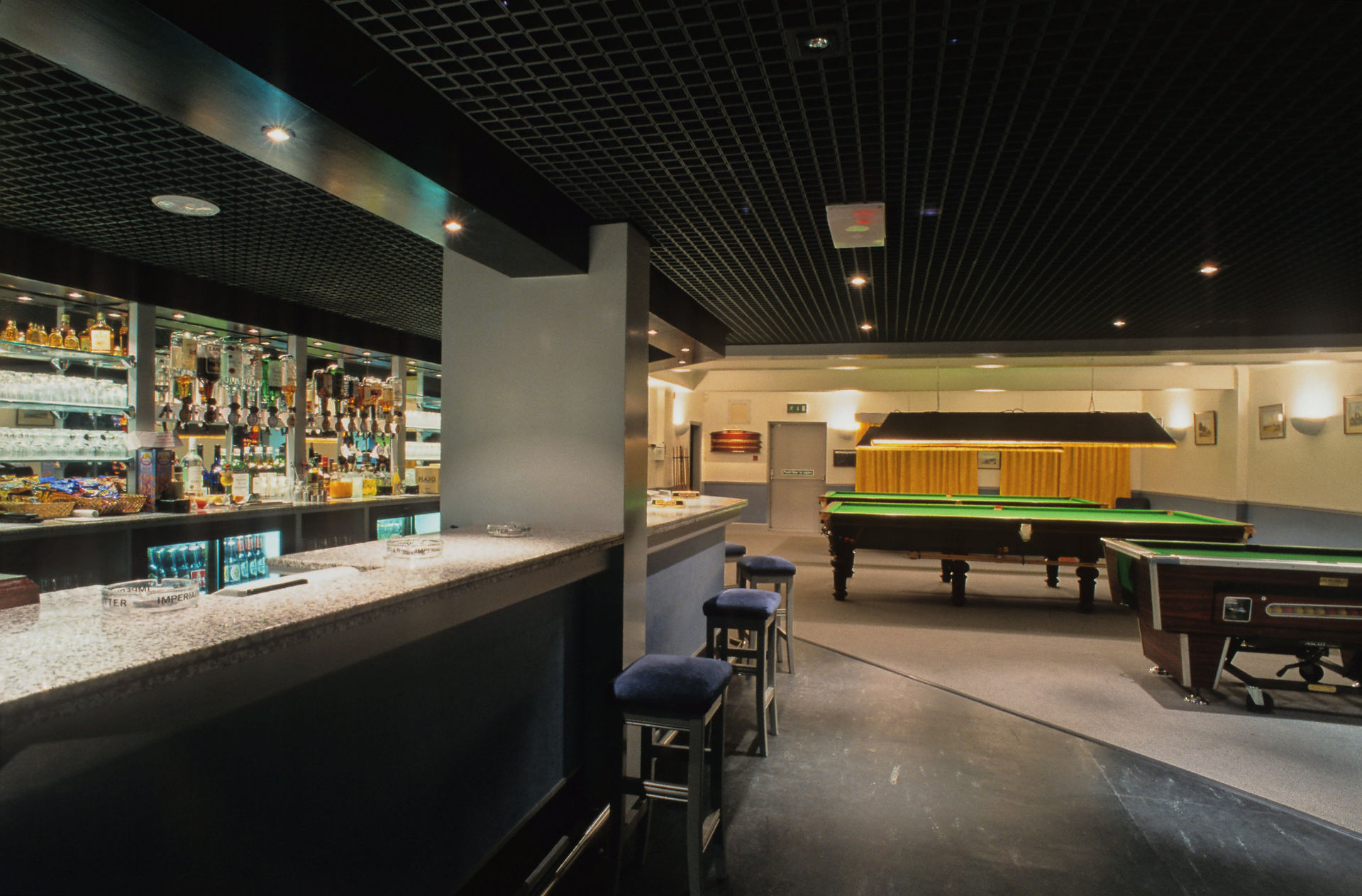 Renovated bar and social club with snooker tables.